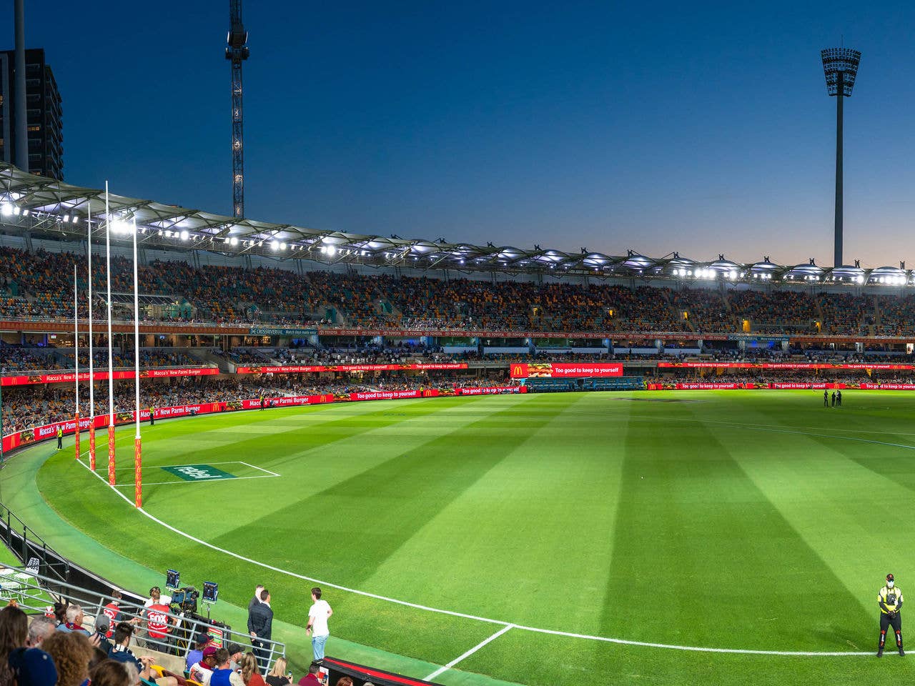 View from of AFL posts and half of field, at night