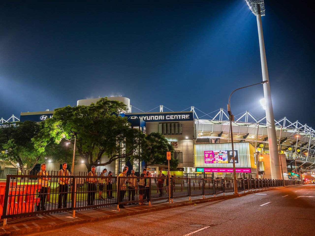 A street leading up to The Gabba Gate 7 lit up at night