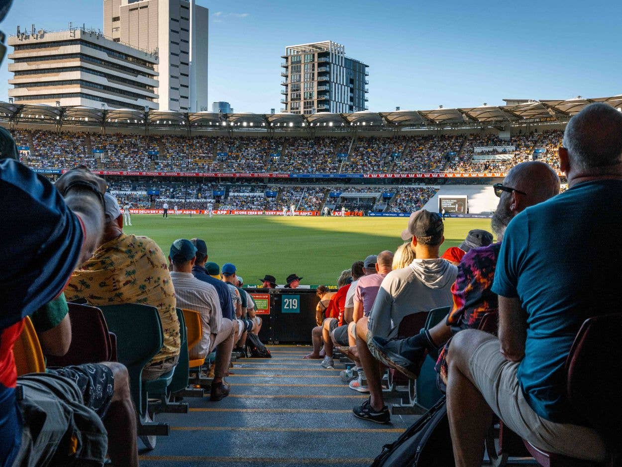 Patrons sitting in seats on in section 219 watching the cricket